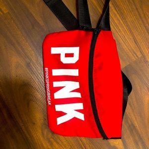 Pink fanny pack in “Red”
